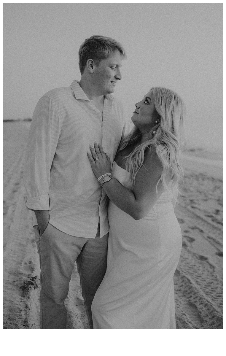 black and white int8imate moment of couple looking at each other during sunrise elopement in florida