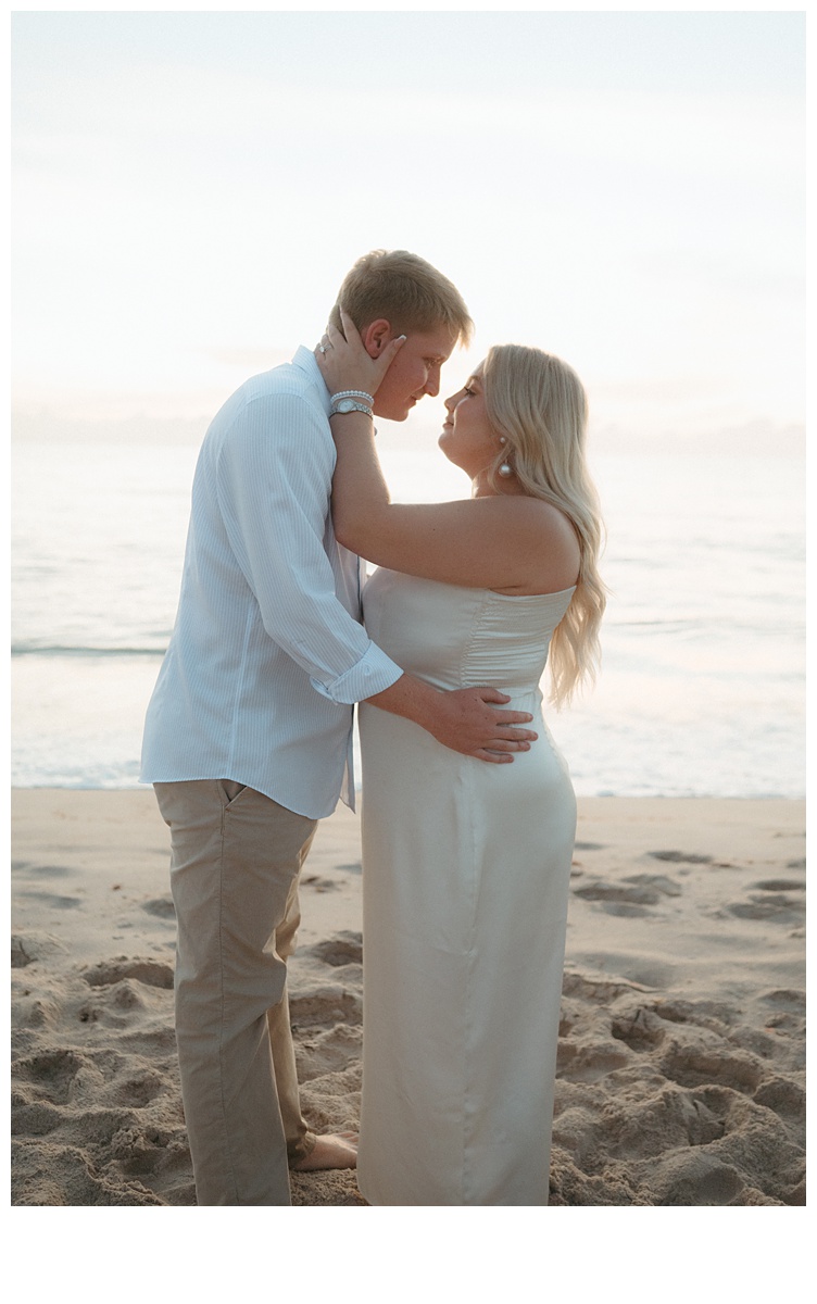 intimate moment between bride and groom during florida beach elopement at sebastian inlet beach