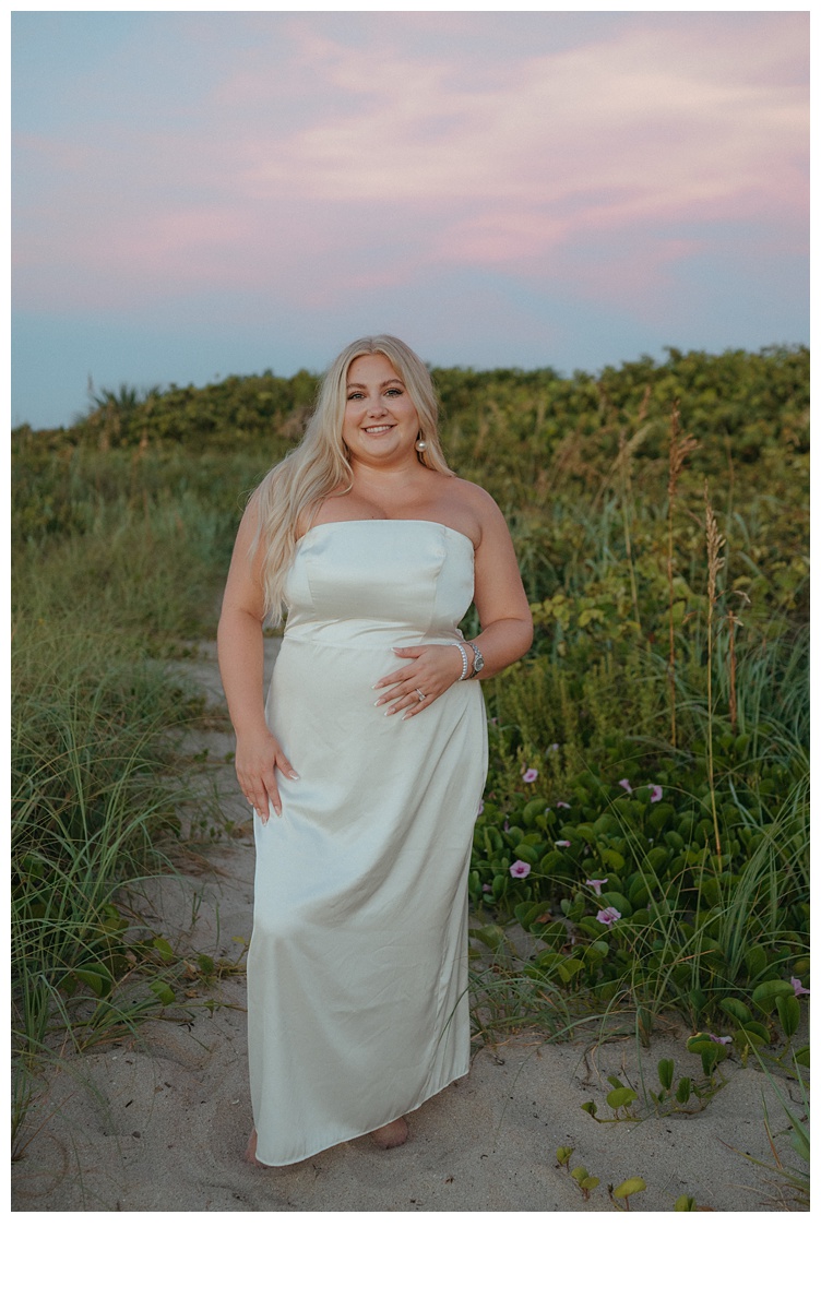 bride posing and smiling at camera ayt sebastian inlet beach 