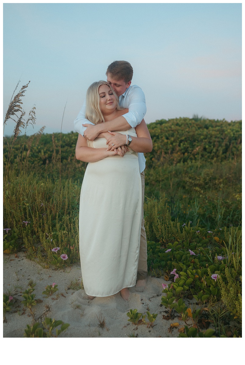 bride and groom hugging intimately on berm at sebastian beach