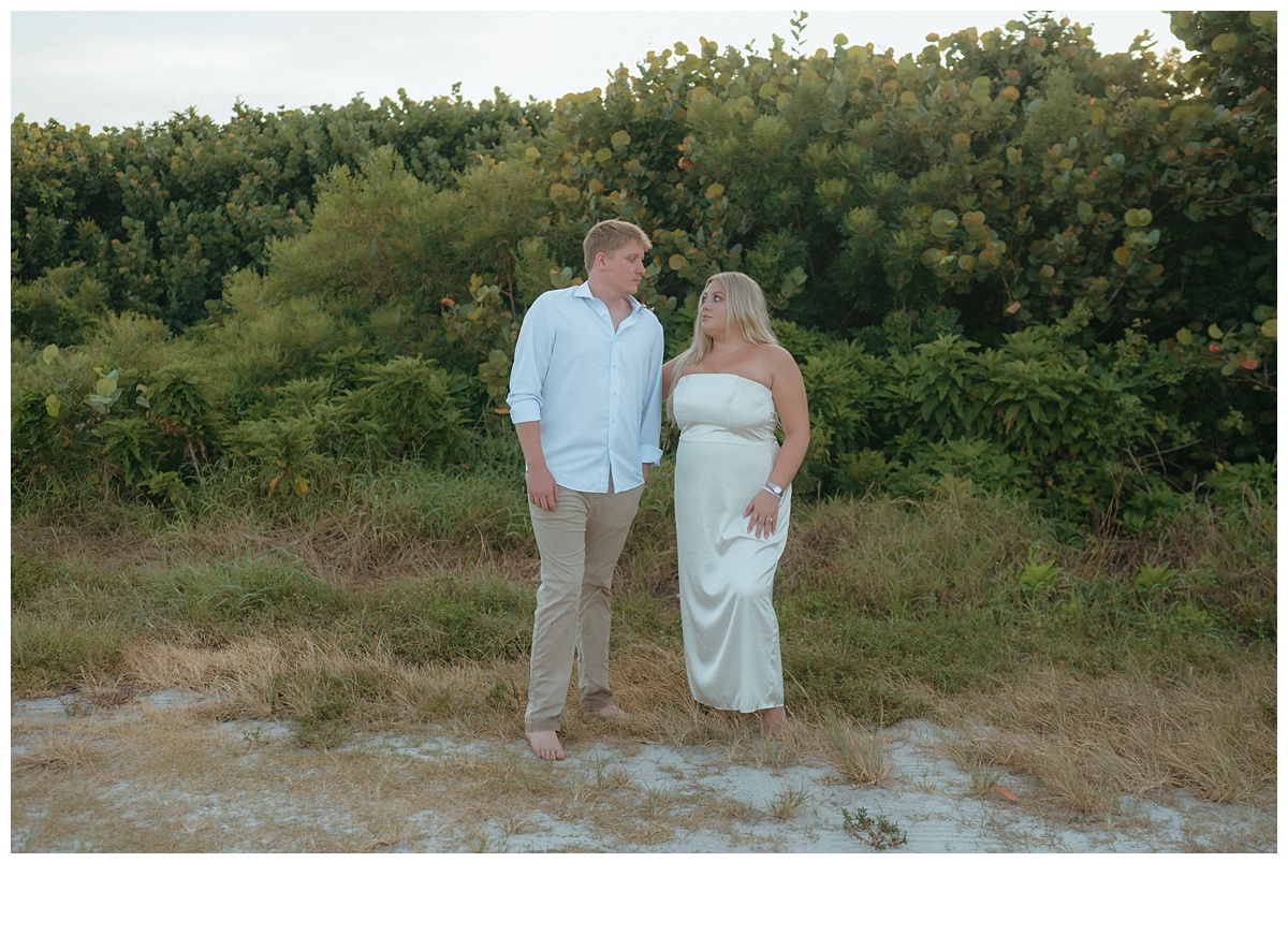 couple looking at each other during bridal portraits at sebastian inlet beach