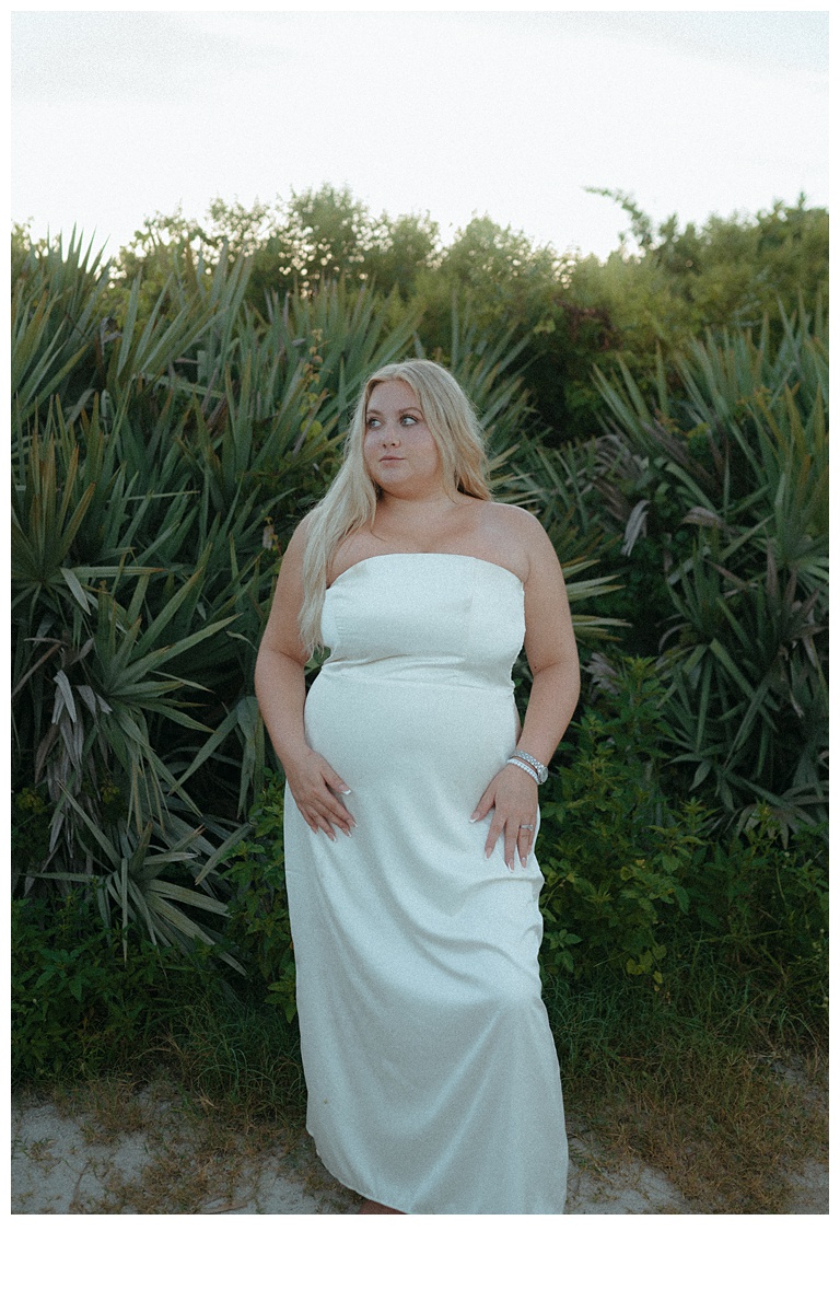 bride posing after her elopement at sebastian inlet beach