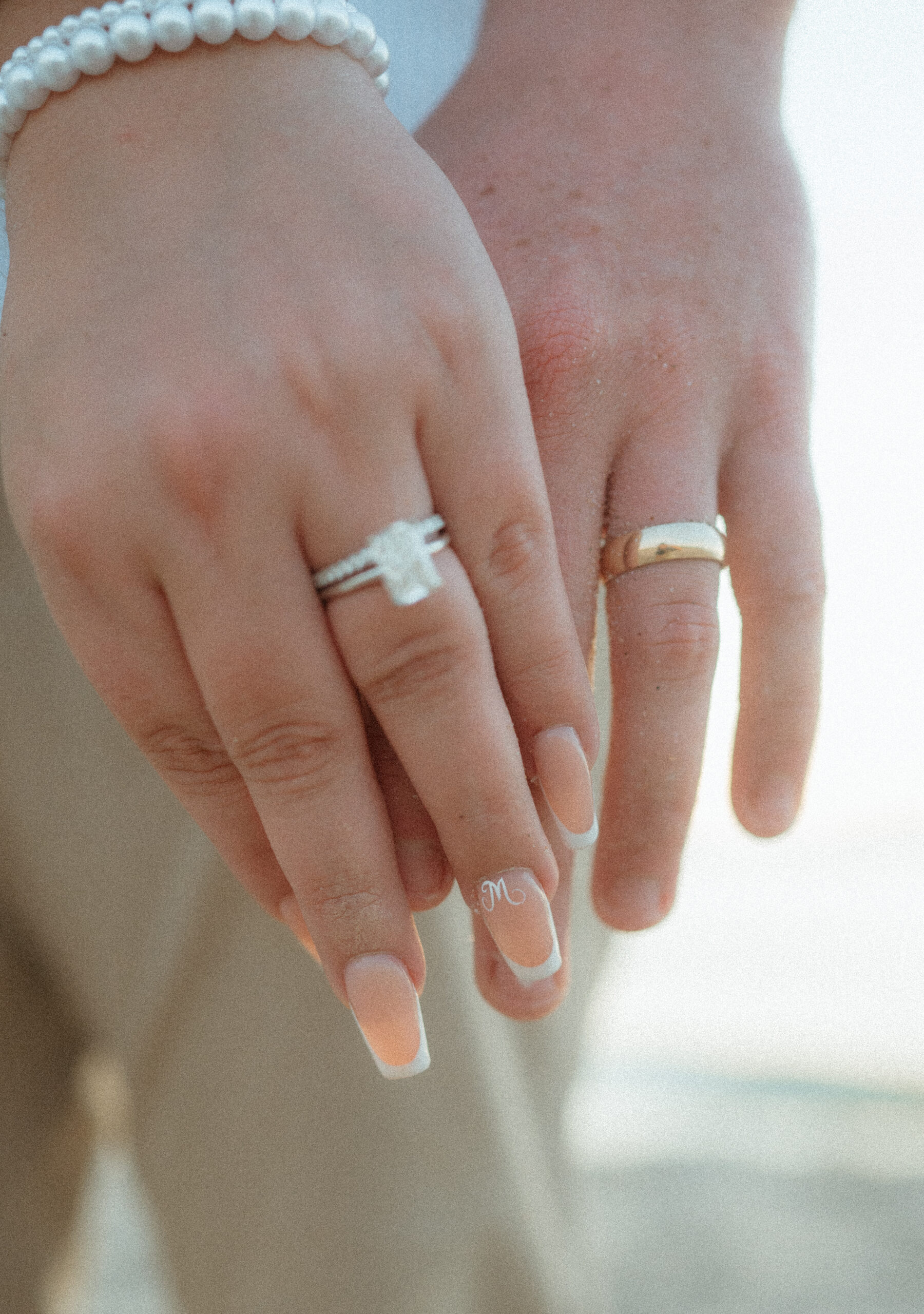 focus shot of bride and grooms rings