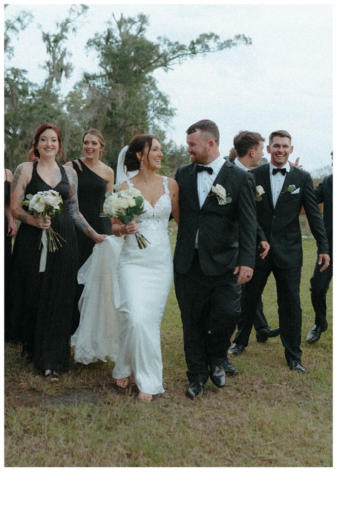 bride and groom front and center with bridal party