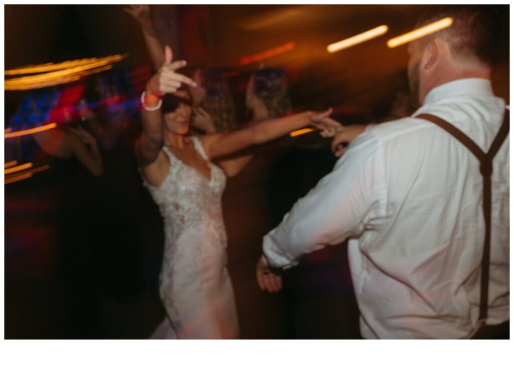 fun and unique shutter drag reception photo of bride and groom