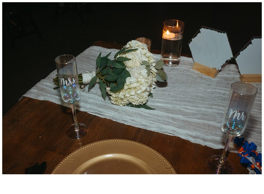 bride and groom reception table flash photo detail