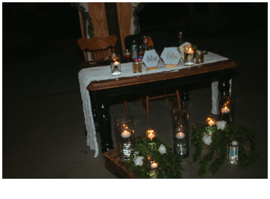 bride and groom reception table flash photo detail