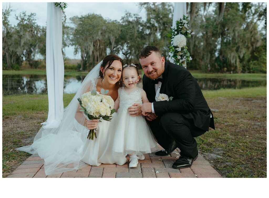 bride and groom with flower girl at black willow ranch mims