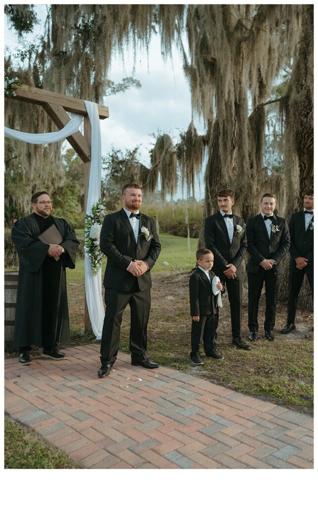 groom reaction watching bride walk down the aisle