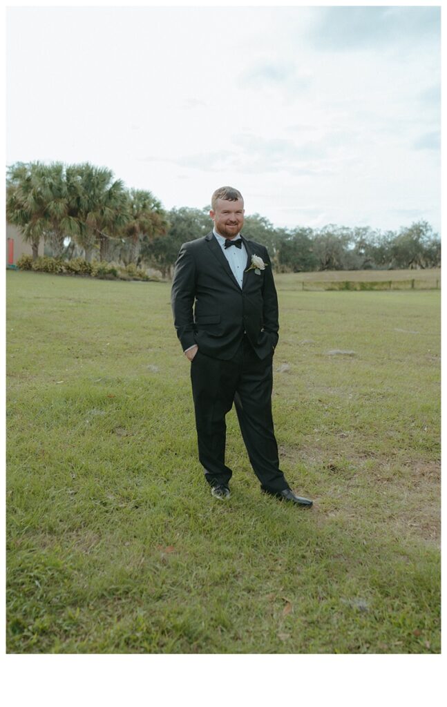 Groom portraits outside of barn