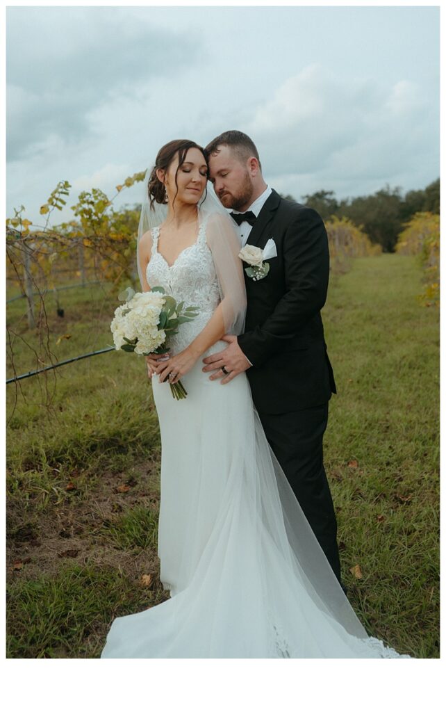 emotional wedding photo of bride and groom in Mims, FL
