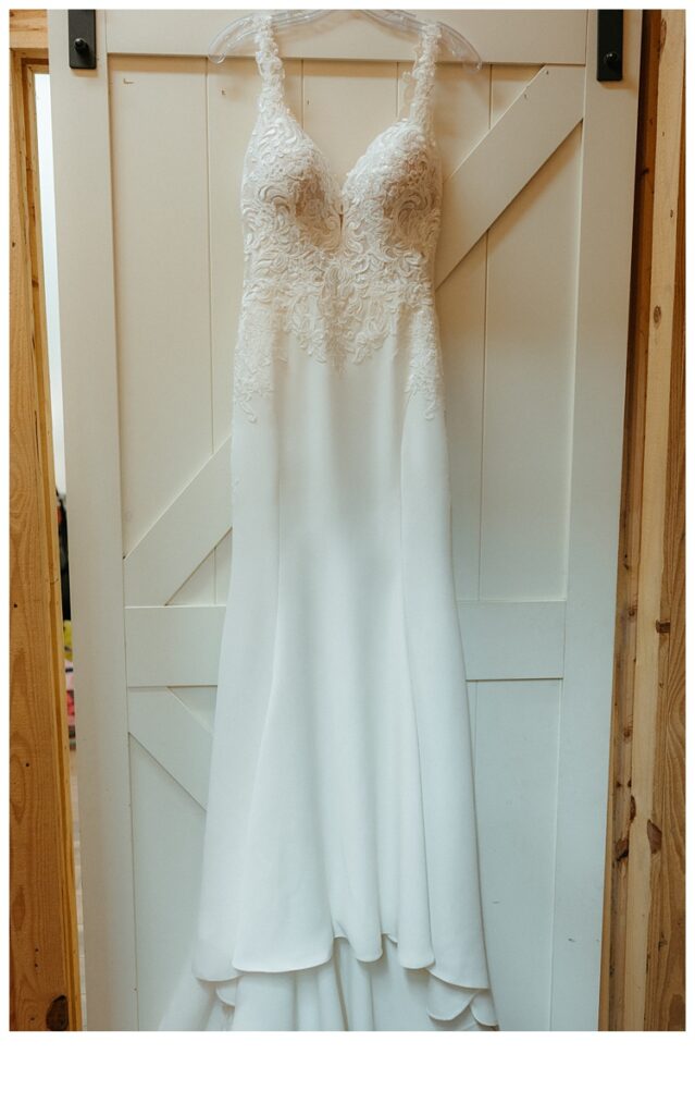 bride dress hanging on door