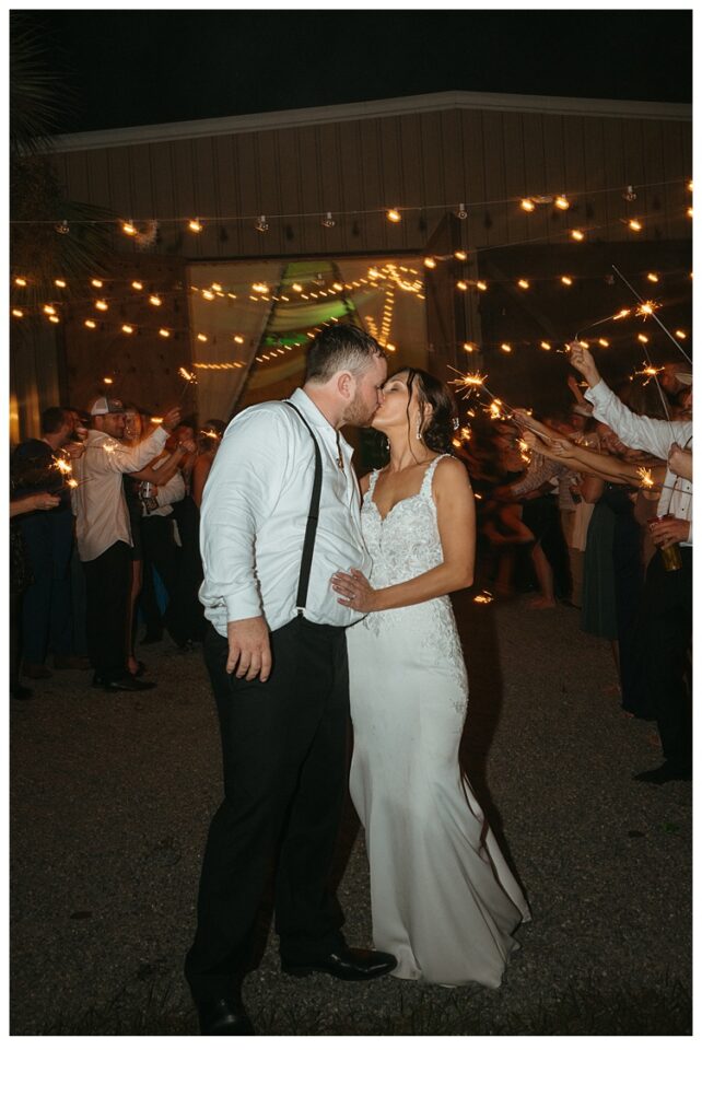 bride and groom grand exit kiss at Black willow ranch mims