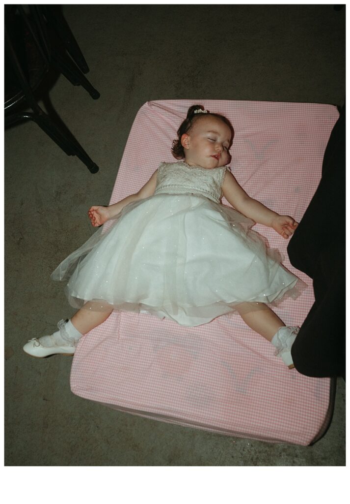 flower girl sleeping during reception at black willow ranch mims