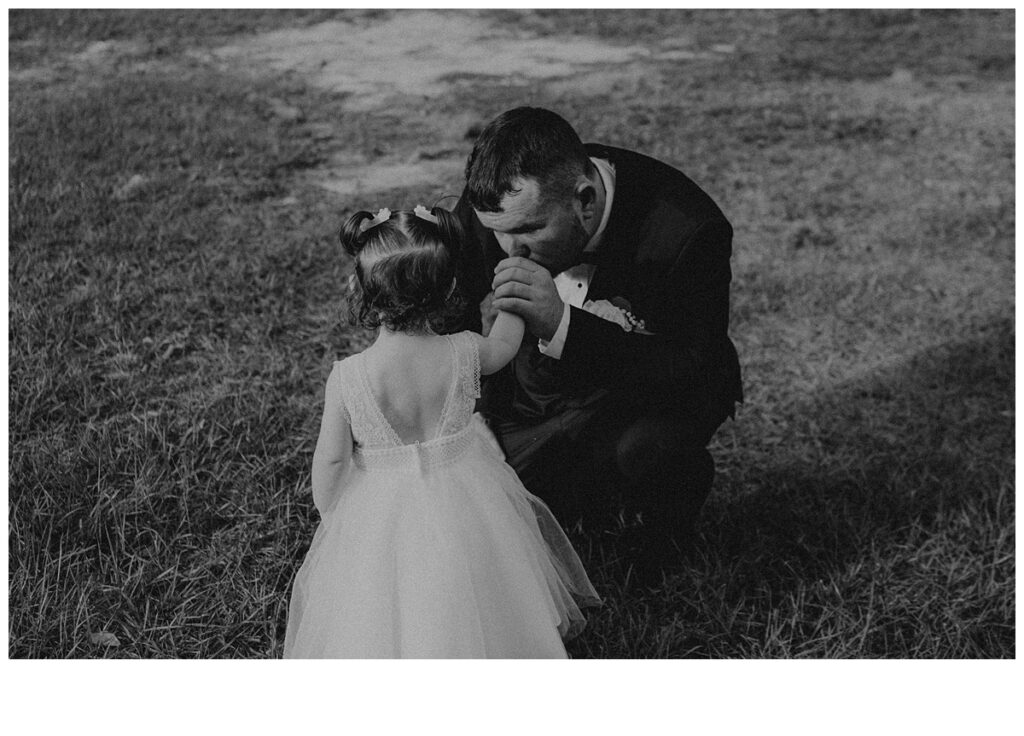 black and white photo of daddy and daughter first look at black willow ranch