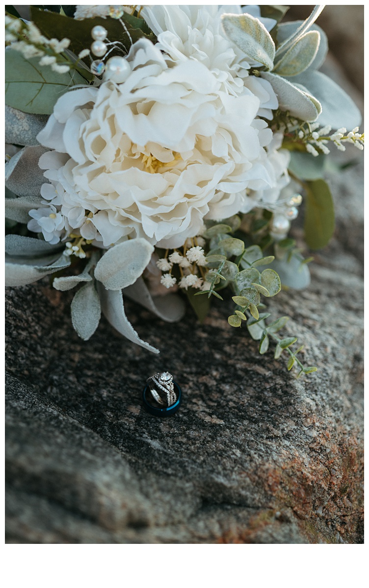 bride bouquet and wedding rings