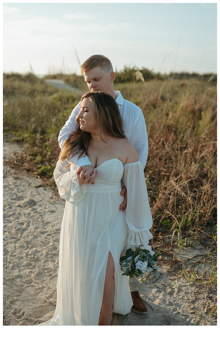 intimate moment on the sand dunes at jetty park