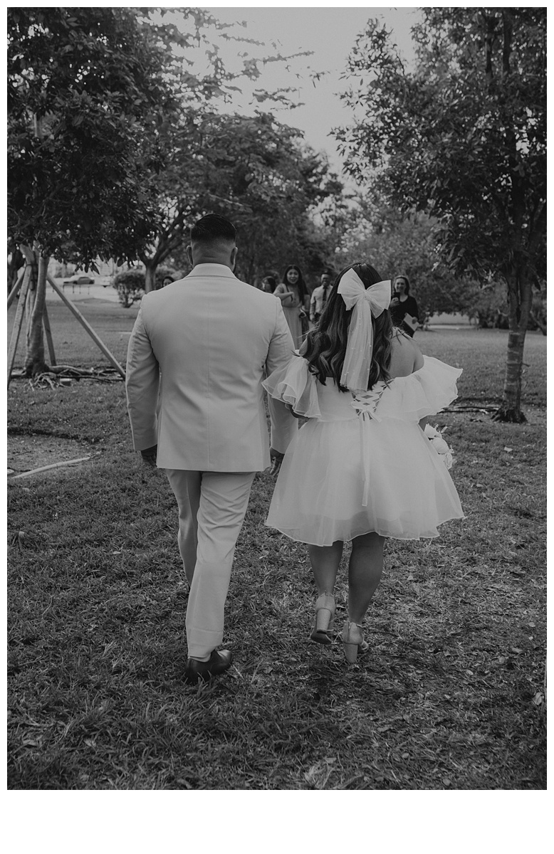 black and white bride and groom walking together