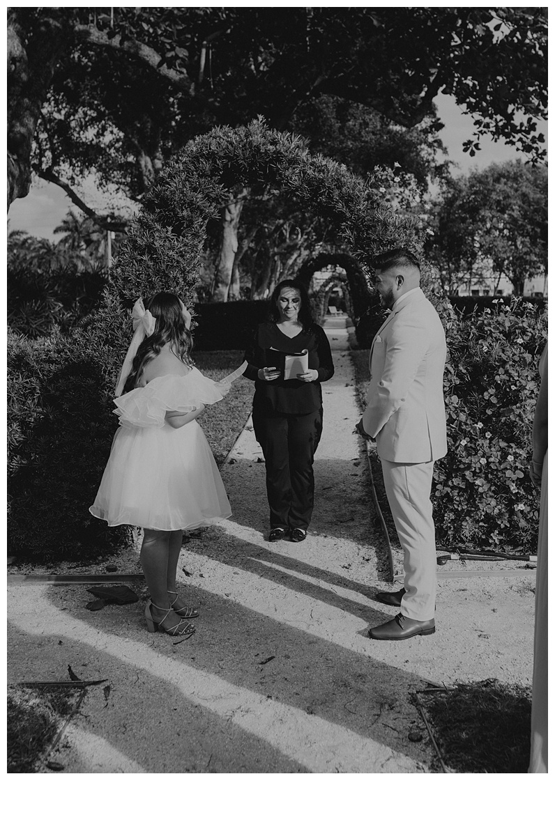 black and white bride reading handwritten vows