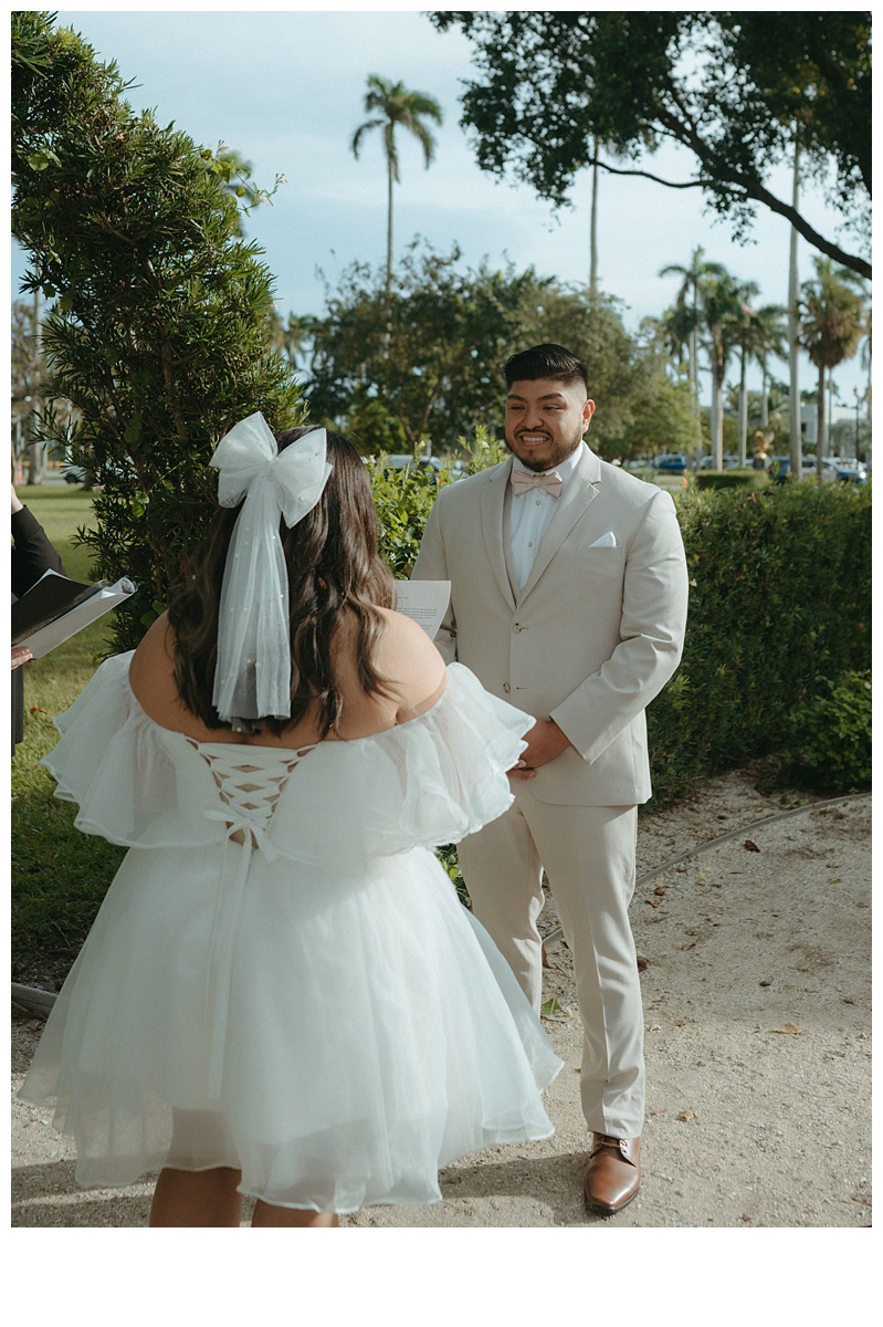 groom smiling at bride during elopement ceremony