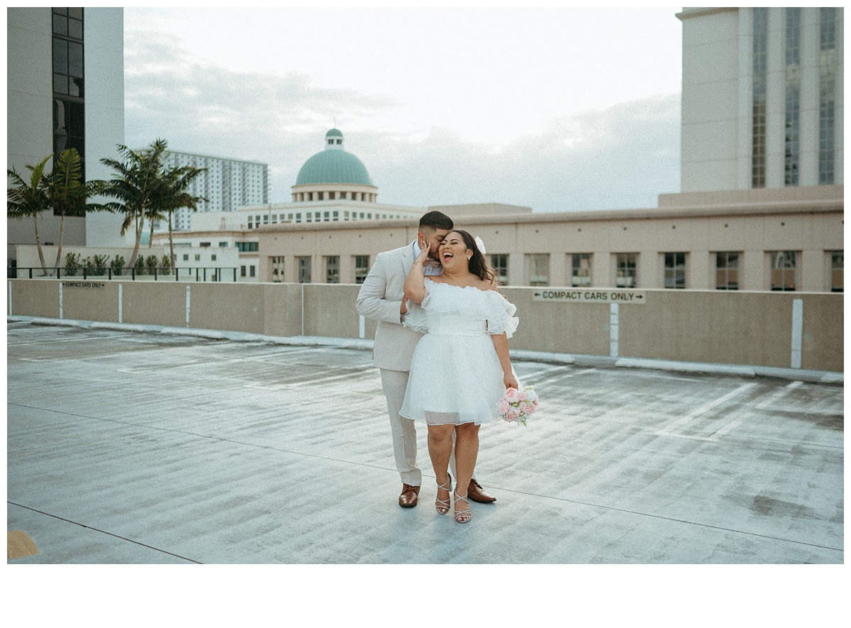 fun bride and groom parking garage rooftop portrait