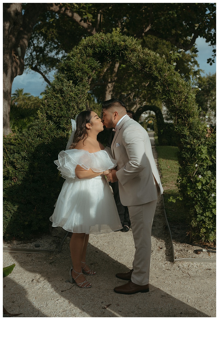 bride and groom first kiss after saying "i do!"