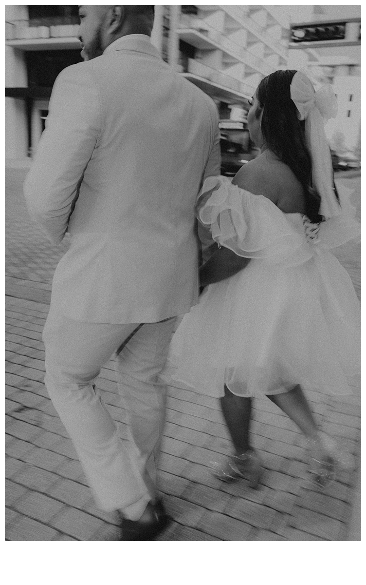 black and white couple walking through palm beach