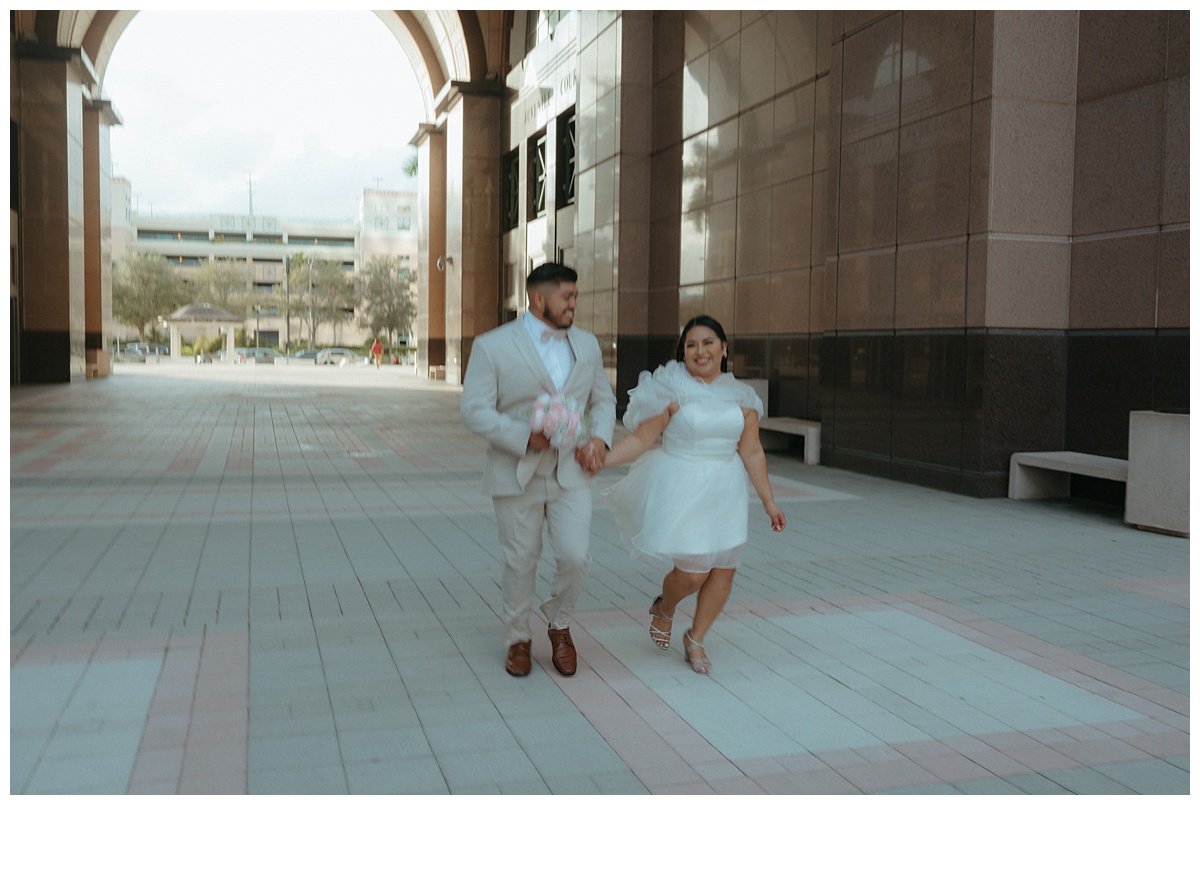 fun runaway moment with bride and groom at courthouse