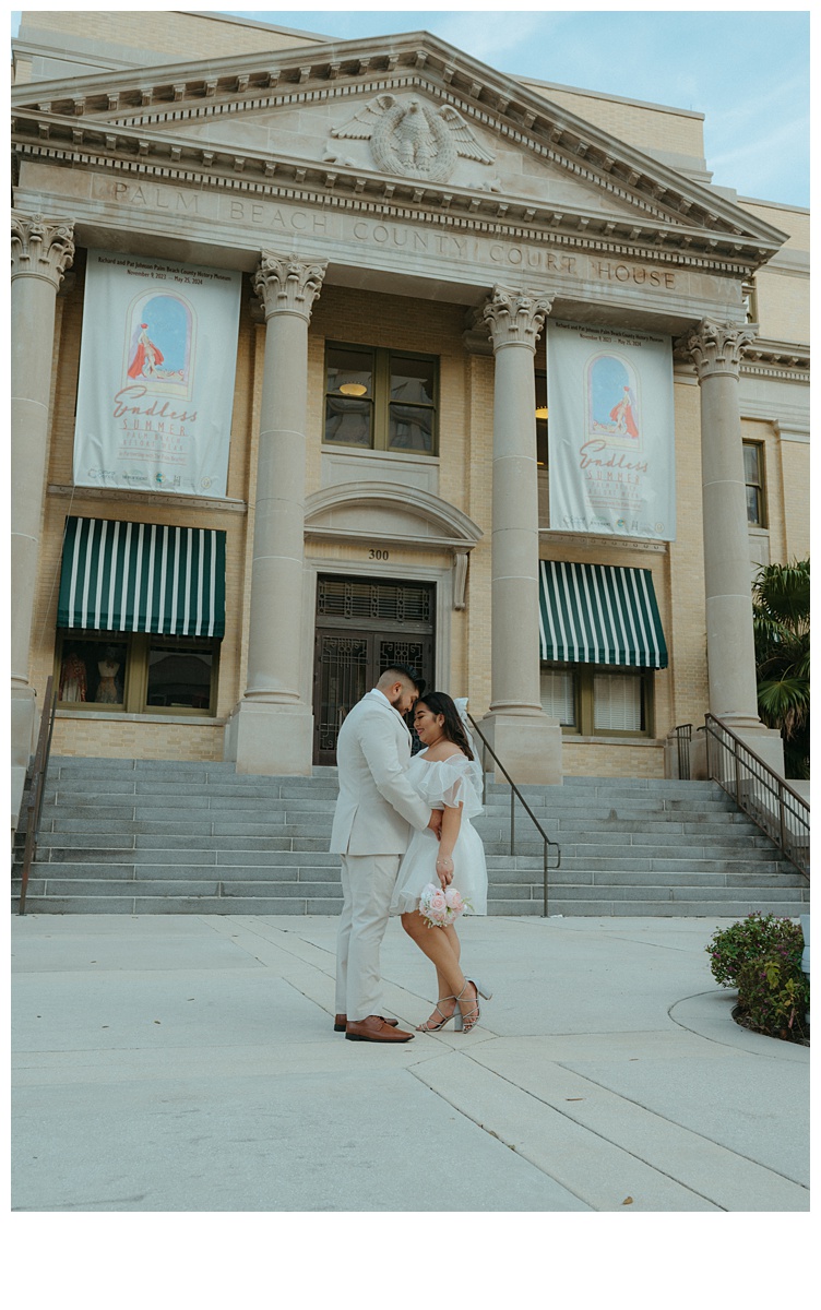 intimate moment between bride and groom at palm beach courthouse 