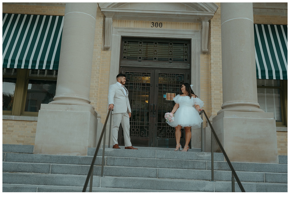 fun bride and groom on opposite sides smiling at each other after elopement ceremony at palm beach courthouse