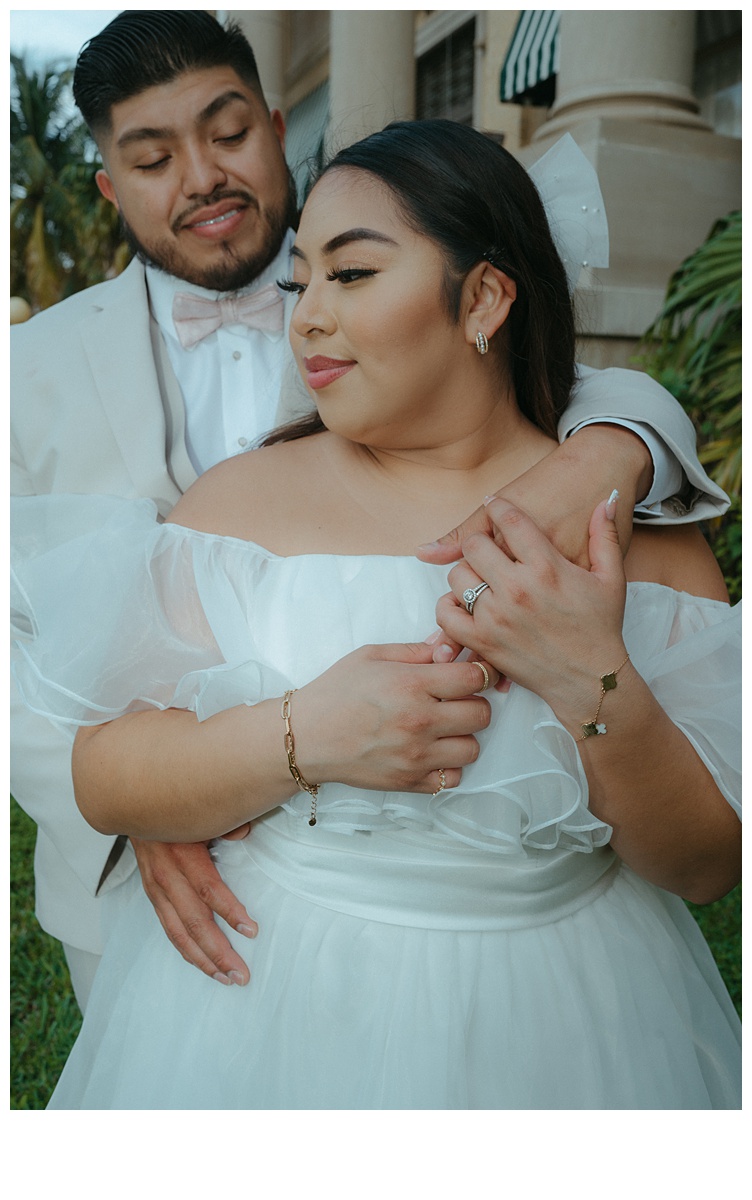 intimate hug with bride and groom