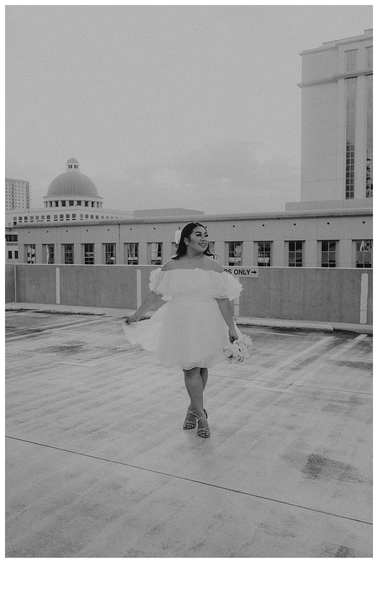 black and white photo of bride smiling away from camera