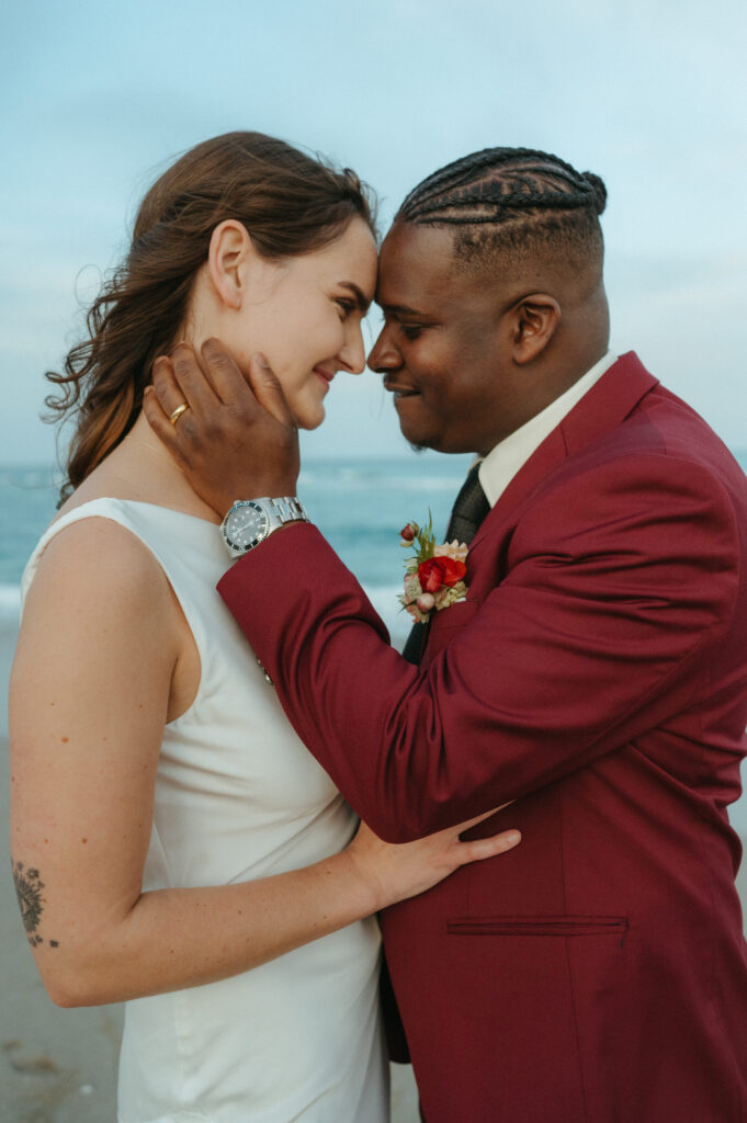 Bride and groom embracing during their beach elopement in Florida