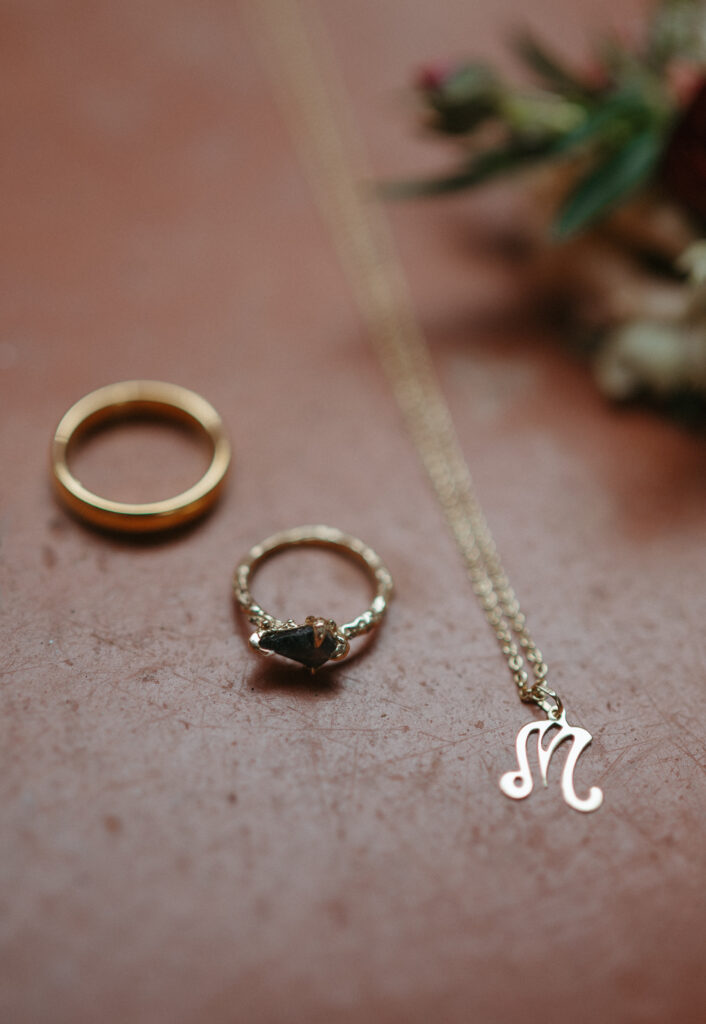 Wedding rings and a necklace for a Florida elopement