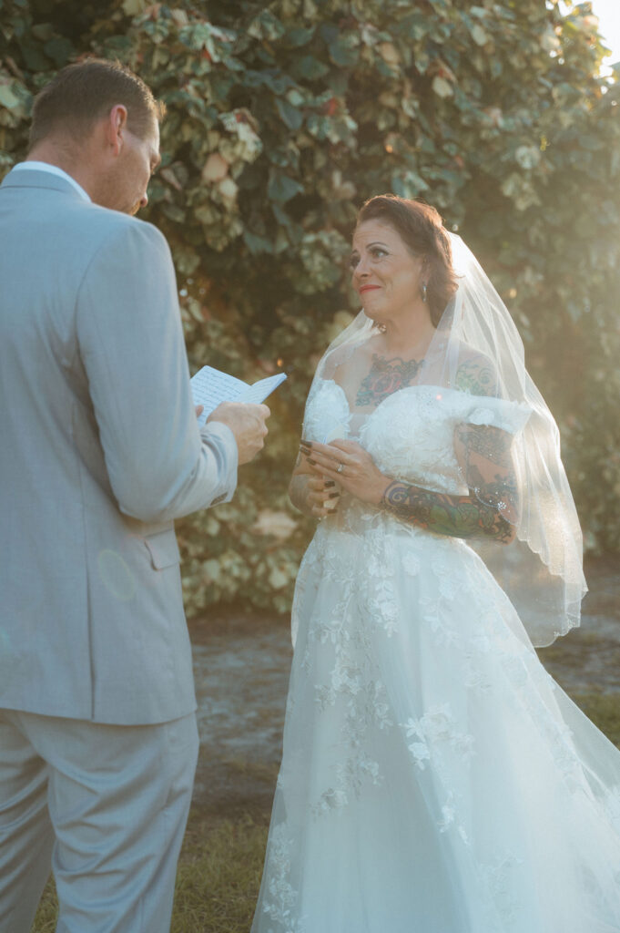 A groom saying private vows to his wife