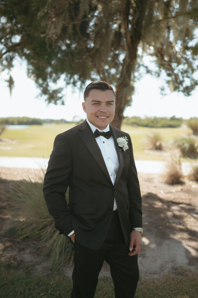 groom wearing a black tux