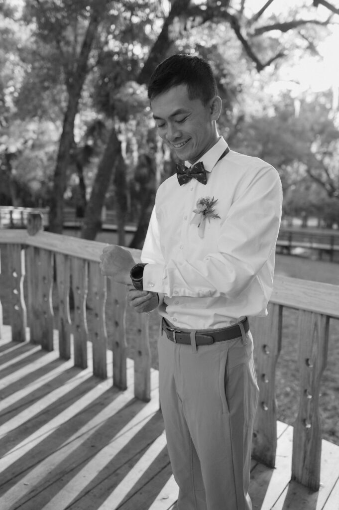 Groom getting ready before his elopement at Kelly Park Springs in Florida