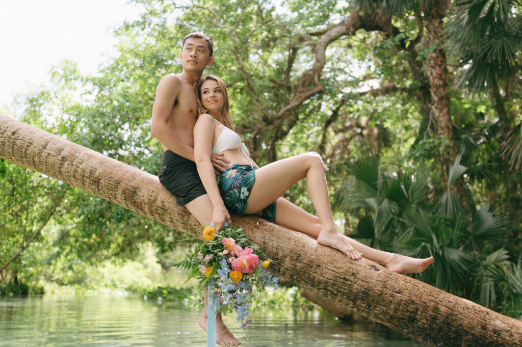 Intimate elopement photos in swimsuits at Kelly Park Springs in Florida