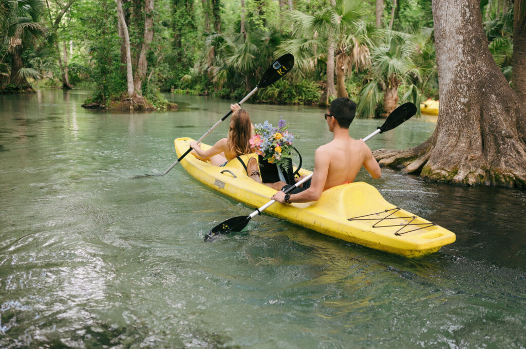 Intimate elopement photos in swimsuits at Kelly Park Springs in Florida