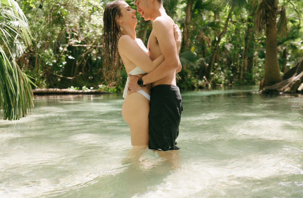 Intimate elopement photos in swimsuits at Kelly Park Springs in Florida