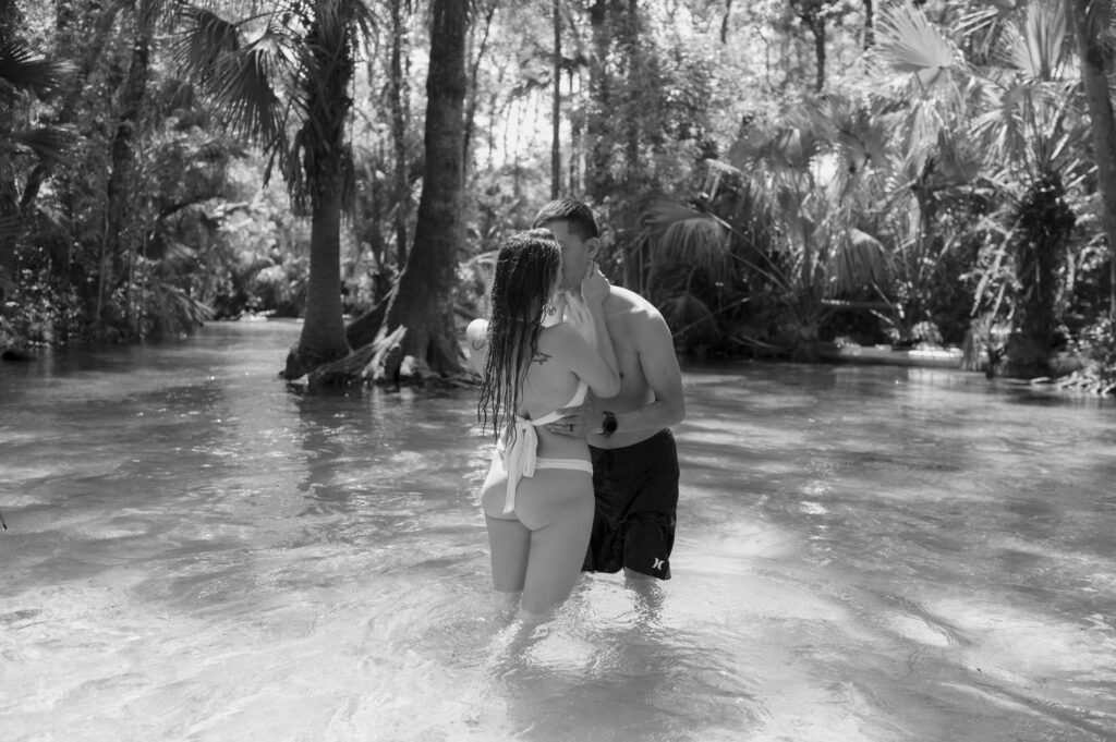 Intimate elopement photos in swimsuits at Kelly Park Springs in Florida