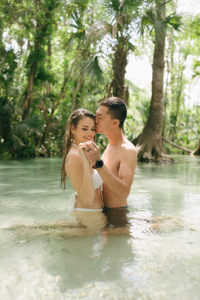 Intimate elopement photos in swimsuits at Kelly Park Springs in Florida