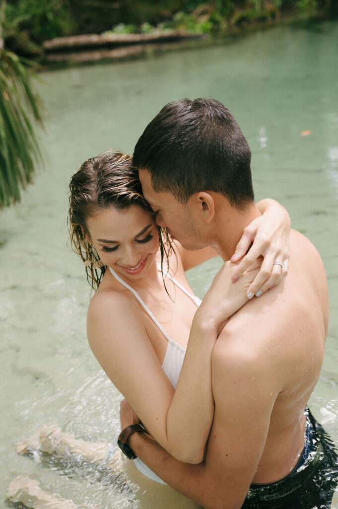 Intimate elopement photos in swimsuits at Kelly Park Springs in Florida