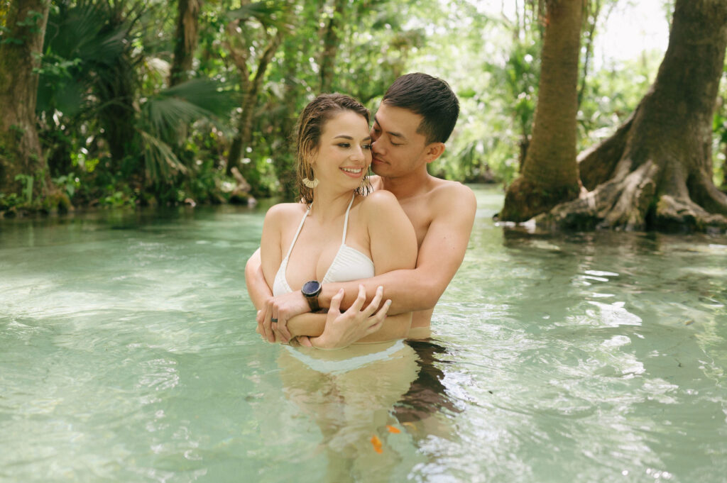 Intimate elopement photos in swimsuits at Kelly Park Springs in Florida