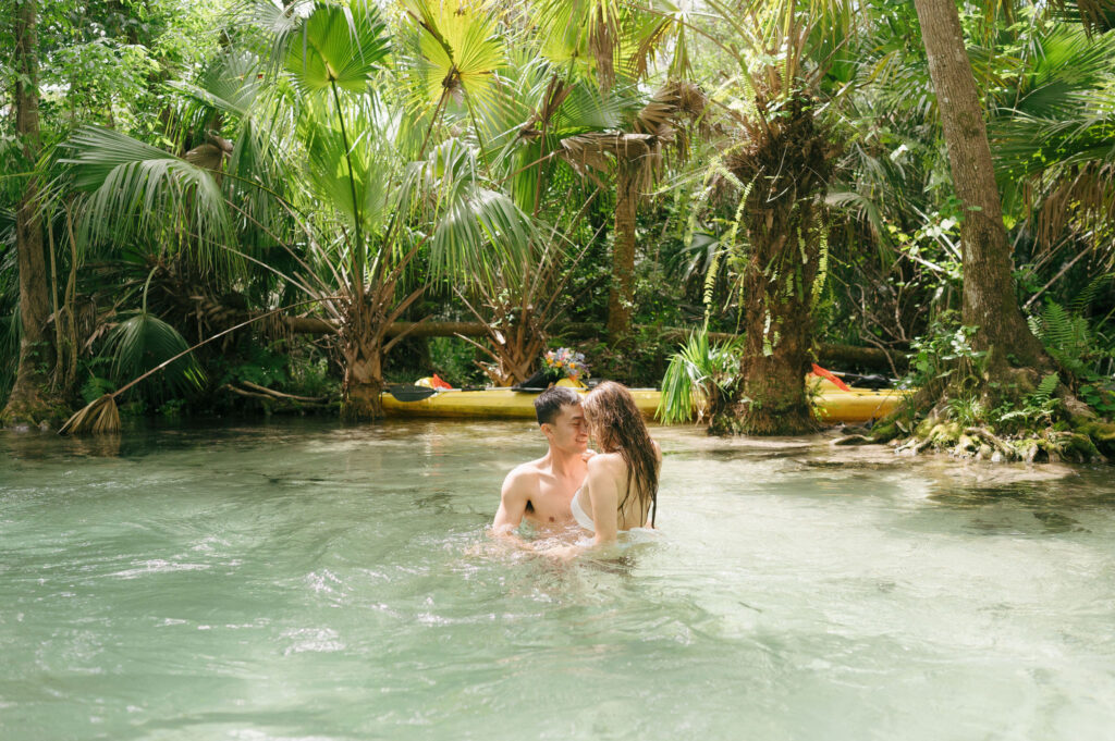 Intimate elopement photos in swimsuits at Kelly Park Springs in Florida